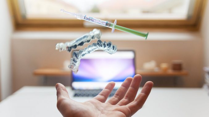 syringe floating near person s hand