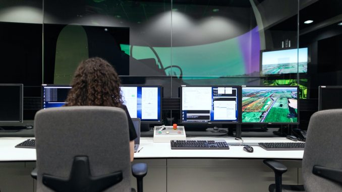 female engineer controlling flight simulator