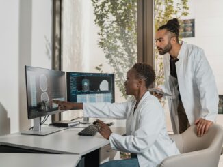 a man showing something on the computer