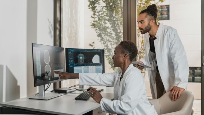 a man showing something on the computer
