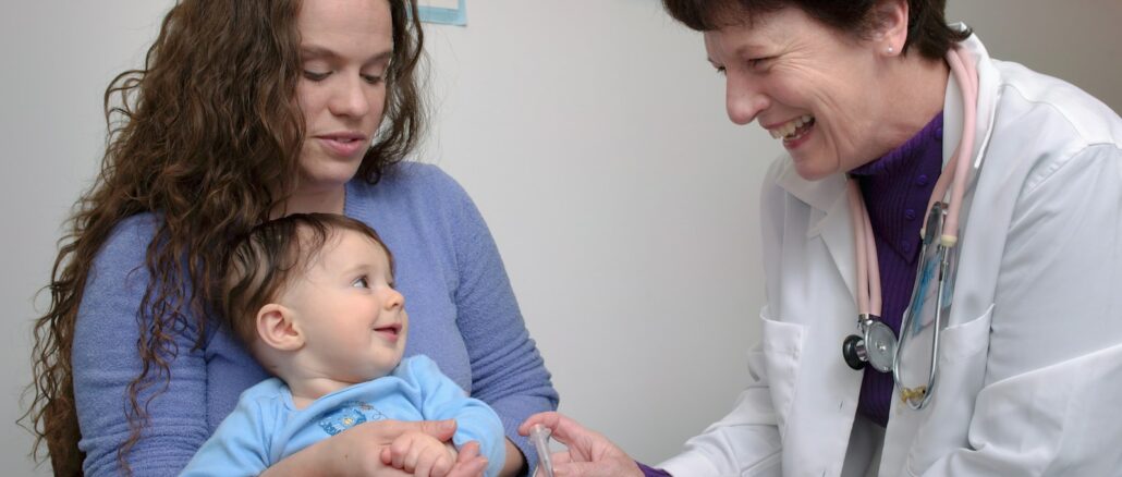 a young child is being examined by a doctor
