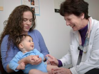 a young child is being examined by a doctor