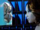 a female mannequin is looking at a computer screen